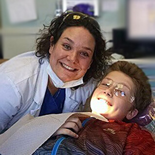 Dr. Delaney smiling with patient