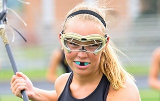 Teen girl with sports mouthguard